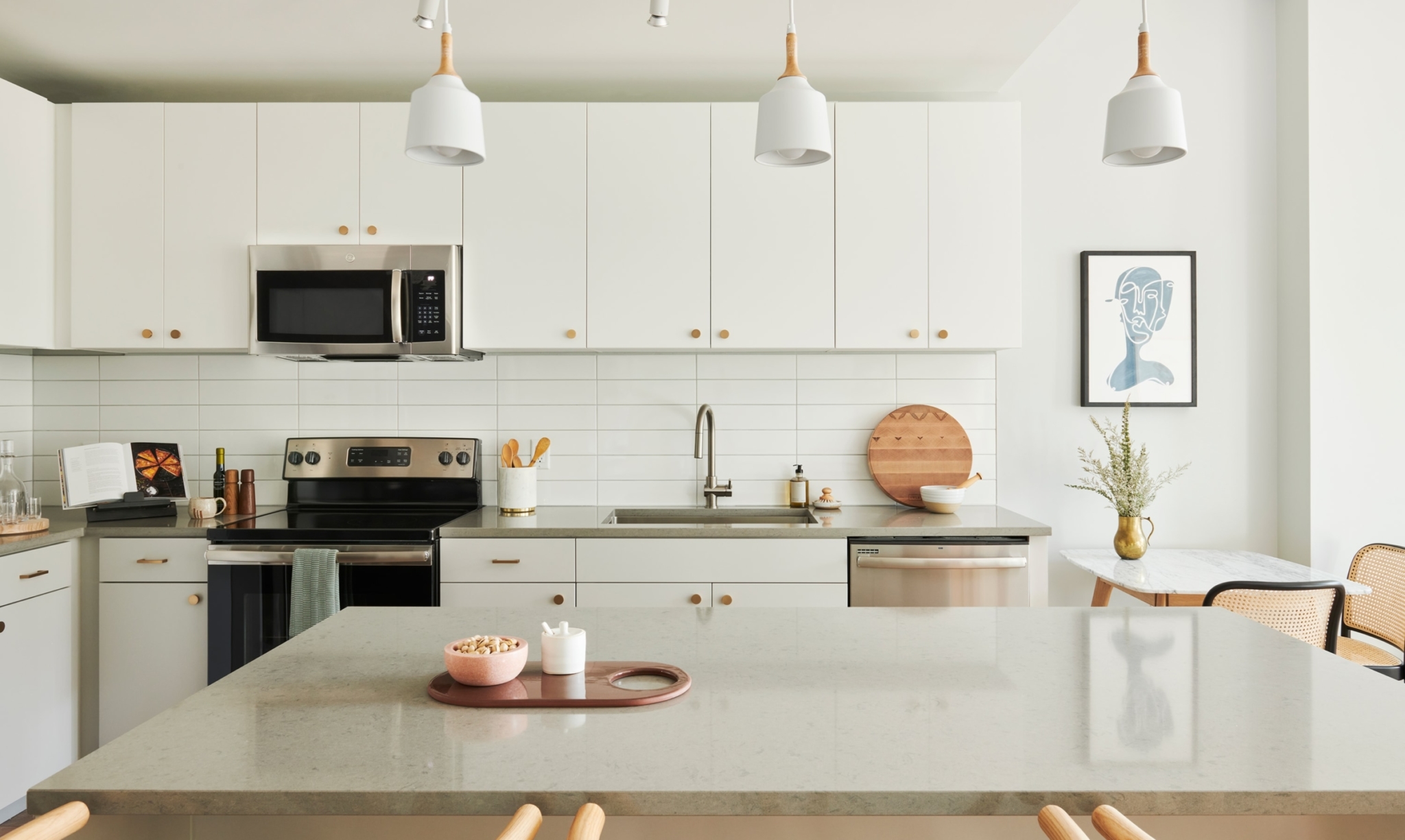 A beautiful kitchen at The Odeon with Euro-style, white cabinets.