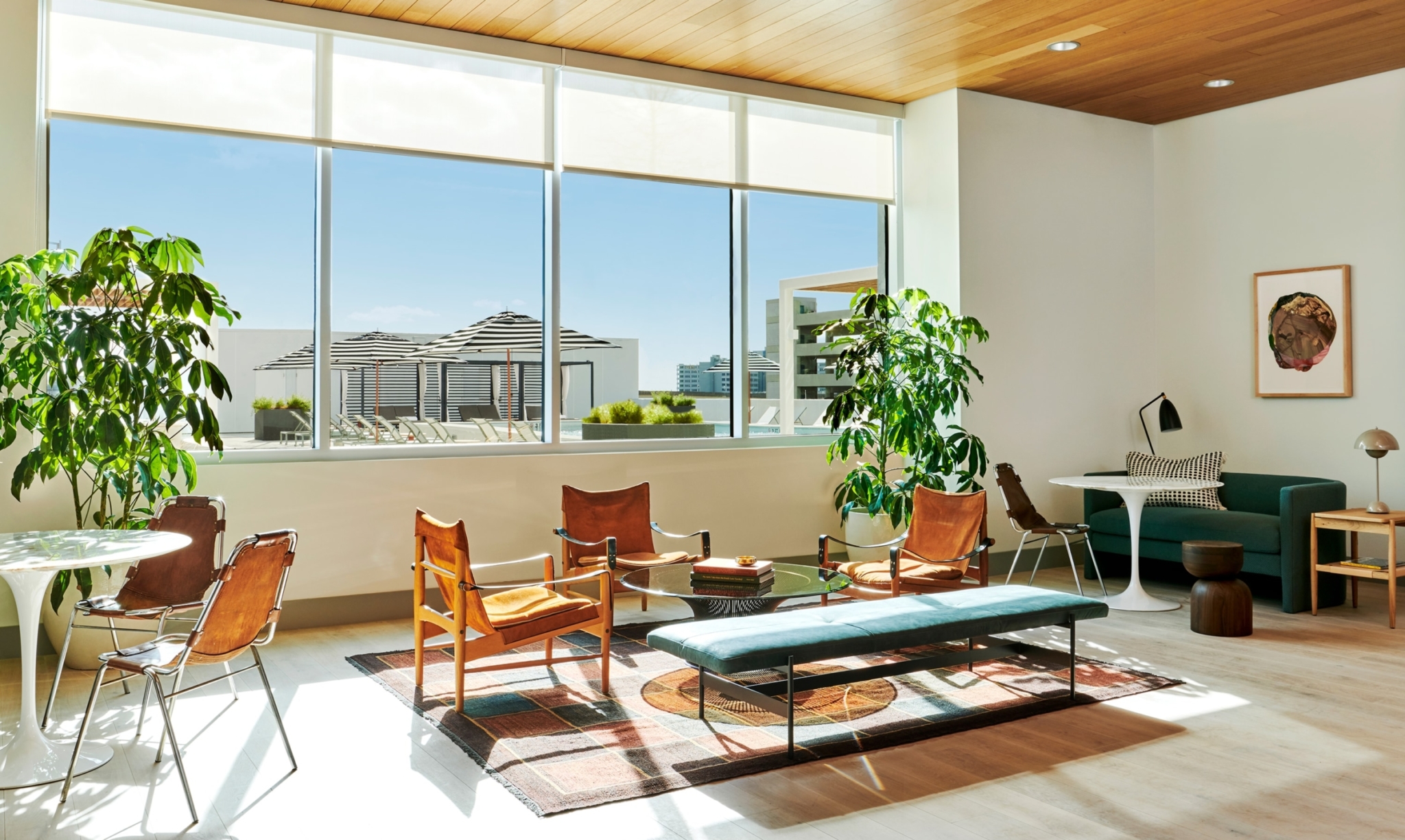 Clubroom seating at The Odeon with ample natural light pouring through oversized windows.