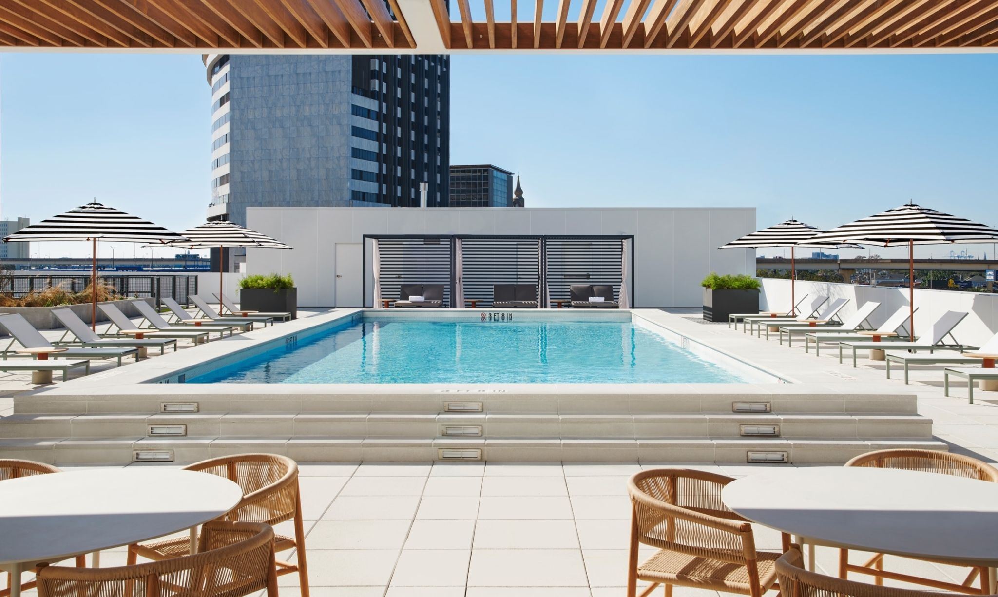 View of the resort-style pool from a cabana seat